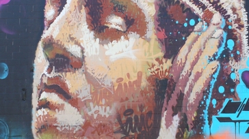 girl with hands to ear