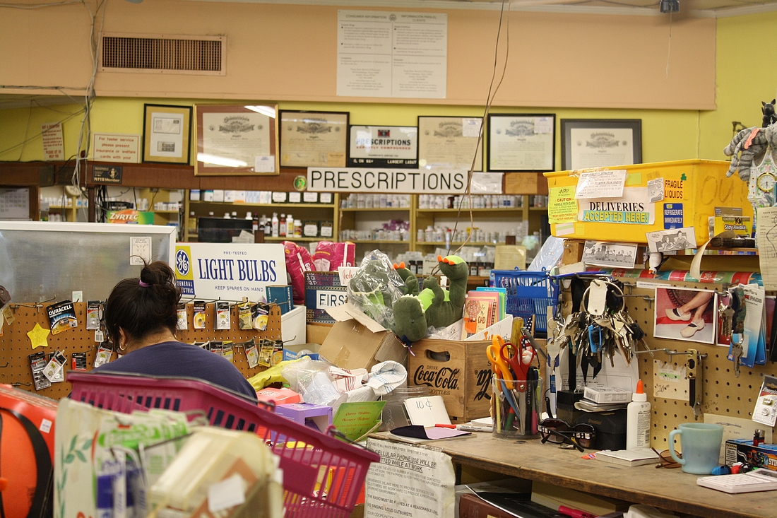 Nau's Enfield Drug, stuffed aisles with pharmacy way to the rear, Austin, TX