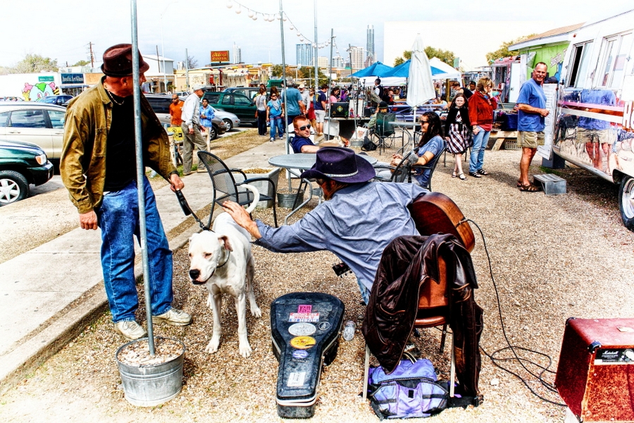 Musician petting dog, SoCo, Austin